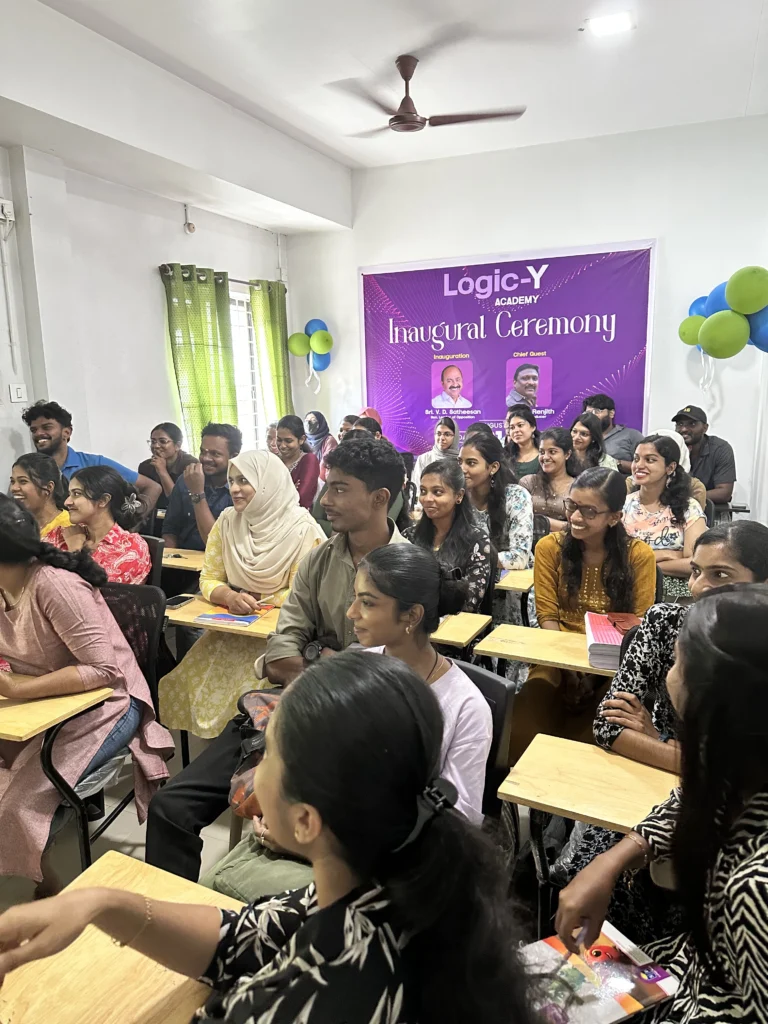 Group of students listening during a collaborative learning session at Logic Y